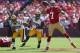 SAN FRANCISCO, CA - SEPTEMBER 08: Quarterback Colin Kaepernick #7 of the San Francisco 49ers is pursued by Micah Hyde #33 and Mike Neal #96 of the Green Bay Packers at Candlestick Park on September 8, 2013 in San Francisco, California. (Photo by Jeff Gr