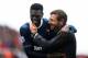 STOKE ON TRENT, ENGLAND - MAY 12: Match winning goalscorer Emmanuel Adebayor is congratulated by Spurs manager Andre Villas-Boas following the final whistle during the Barclays Premier League match between Stoke City and Tottenham Hotspur at Britannia St