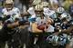 Dec 22, 2013; Charlotte, NC, USA; New Orleans Saints quarterback Drew Brees (9) is sacked as Carolina Panthers defensive end Greg Hardy (76) comes from the left and cornerback Captain Munnerlyn (41) holds Brees's jersey and free safety Mike Mitchell (21)