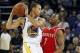 February 12, 2012; Oakland, CA, USA; Golden State Warriors guard Stephen Curry (30) is defended by Houston Rockets guard Kyle Lowry (7) in the first quarter at ORACLE Arena. Mandatory Credit: Cary Edmondson-USA TODAY Sports