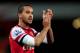 Theo Walcott applauds the Arsenal fans after the Cardiff game.