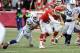 Dec 22, 2013; Kansas City, MO, USA; Kansas City Chiefs quarterback Alex Smith (11) fumbles while being tackled by Indianapolis Colts inside linebacker Jerrell Freeman (50) in the second half at Arrowhead Stadium. Indianapolis won the game 23-7. Mandatory