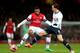 LONDON, ENGLAND - JANUARY 04: Serge Gnabry of Arsenal and Vlad Chiriches of Spurs compete for the ball during the Budweiser FA Cup third round match between Arsenal and Tottenham Hotspur at Emirates Stadium on January 4, 2014 in London, England. (Photo