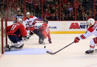 WASHINGTON, DC - JANUARY 02:  Jeff Skinner #53 of the Carolina Hurricanes scores the game winning goal against goalie Philipp Grubauer #31 of the Washington Capitals in overtime to give the Hurricanes a 4-3 win at Verizon Center on January 2, 2014 in Wash