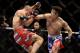 SINGAPORE - JANUARY 04: Tarec Saffiedine (L) fights Lim Hyun Gyu during their UFC Fight Night Singapore welterweight bout at Marina Bay Sands on January 4, 2014 in Singapore. (Photo by Suhaimi Abdullah/Getty Images)