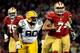 SAN FRANCISCO, CA - JANUARY 12: Quarterback Colin Kaepernick #7 of the San Francisco 49ers runs the ball against nose tackle B.J. Raji #90 of the Green Bay Packers during the NFC Divisional Playoff Game at Candlestick Park on January 12, 2013 in San Fran