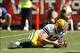 Sep 8, 2013; San Francisco, CA, USA; Green Bay Packers quarterback Aaron Rodgers (12) recovers a fumble against the San Francisco 49ers in the first quarter at Candlestick Park. Mandatory Credit: Cary Edmondson-USA TODAY Sports