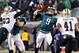Jan 4, 2014; Philadelphia, PA, USA; Philadelphia Eagles quarterback Nick Foles (9) throws the ball as New Orleans Saints outside linebacker Junior Galette (93) defends in the second quarter during the 2013 NFC wild card playoff football game at Lincoln Fi