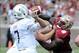 Oct 5, 2013; Tallahassee, FL, USA; Florida State Seminoles defensive tackle Timmy Jernigan (8) puts pressure on Maryland Terrapins quarterback Caleb Rowe (7) during the second half of the game at Doak Campbell Stadium. Mandatory Credit: Melina Vastola-USA
