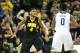 Dec 3, 2013; Iowa City, IA, USA; Iowa Hawkeyes guard Roy Devyn Marble (4) defends Notre Dame Fighting Irish guard Eric Atkins (0) at Carver-Hawkeye Arena. Iowa won 98-93. Mandatory Credit: Reese Strickland-USA TODAY Sports