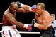 LAS VEGAS - APRIL 10: Evander Holyfield (L) hits Francois Botha in the first round of their heavyweight bout at the Thomas & Mack Center April 10, 2010 in Las Vegas, Nevada. Holyfield won by TKO in the eighth round. (Photo by Ethan Miller/Getty Images)
