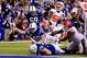 INDIANAPOLIS, IN - JANUARY 04: Quarterback Andrew Luck #12 of the Indianapolis Colts scores a touchdown in the fourth quarter after recovering a fumble against the Kansas City Chiefs during a Wild Card Playoff game at Lucas Oil Stadium on January 4, 2014