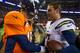 DENVER, CO - DECEMBER 12: Quarterback Peyton Manning #18 of the Denver Broncos congratulates quarterback Philip Rivers #17 of the San Diego Chargers after a 27-20 loss to the San Diego Chargers at Sports Authority Field Field at Mile High on December 12,