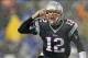 Dec 29, 2013; Foxborough, MA, USA; New England Patriots quarterback Tom Brady (12) signals his teammates at the line of scrimmage during the second quarter against the Buffalo Bills at Gillette Stadium. Mandatory Credit: Winslow Townson-USA TODAY Sports