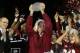 PASADENA, CA - JANUARY 06: Florida State Seminoles head coach Jimbo Fisher holds the Coaches' Trophy after defeating the Auburn Tigers 34-31 in the 2014 Vizio BCS National Championship Game at the Rose Bowl on January 6, 2014 in Pasadena, California. (P
