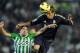 SEVILLE, SPAIN - NOVEMBER 24: Fabio Coentrao (R) of Real Madrid goes for a high ball against Salvador Arga of Real Betis Balompie during the La Liga match between Real Betis Balompie and Real Madrid CF at Estadio Benito Villamarin on November 24, 2012 in