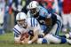 NASHVILLE,TN - DECEMBER 7: Quarterback Peyton Manning #18 of the Indianapolis Colts gets tackled by defensive end Kevin Carter #93 of the Tennessee Titans during the game on December 7, 2003 at The Coliseum in Nashville, Tennessee. Colts won 29-27. (Pho