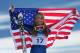 WHISTLER, BC - FEBRUARY 20: Bronze medalist Lindsey Vonn of the United States celebrates with the American flag after the women's alpine skiing Super-G on day nine of the Vancouver 2010 Winter Olympics at Whistler Creekside on February 20, 2010 in Whistl