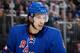 NEW YORK, NY - DECEMBER 20: Michael Del Zotto #4 of the New York Rangers looks on during a break in the action against the New York Islanders at Madison Square Garden on December 20, 2013 in New York City. The New York Islanders won 5-3. (Photo by Scott