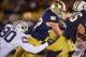 Nov 23, 2013; South Bend, IN, USA; Notre Dame Fighting Irish running back Cam McDaniel (33) carries the ball as BYU Cougars defensive lineman Bronson Kaufusi (90) defends in the third quarter at Notre Dame Stadium. Notre Dame won 23-13. Mandatory Credit: