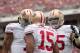 Dec 15, 2013; Tampa, FL, USA; San Francisco 49ers quarterback Colin Kaepernick (left) and guard Alex Boone (right) celebrate with wide receiver Michael Crabtree (15) after a touchdown during the first quarter of the game against the Tampa Bay Buccaneers a
