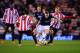 SUNDERLAND, ENGLAND - JANUARY 07: Tom Cleverley of Manchester United takes on Sebastian Larsson (7) and Ki Sung-Yong of Sunderland (4) during the Capital One Cup Semi-Final, first leg match between Sunderland and Manchester United at Stadium of Light on