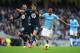 MANCHESTER, ENGLAND - NOVEMBER 24: Erik Lamela of Tottenham Hotspur challenges Fernandinho of Manchester City during the Barclays Premier League match between Manchester City and Tottenham Hotspur at Etihad Stadium on November 24, 2013 in Manchester, Eng