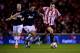 SUNDERLAND, ENGLAND - JANUARY 07: Michael Carrick of Manchester United and Adam Johnson of Sunderland battle for the ball during the Capital One Cup Semi-Final, first leg match between Sunderland and Manchester United at Stadium of Light on January 7, 20