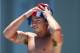BARCELONA, SPAIN - JULY 28: Tom Daley of Great Britain dries himself during the Men's 10m Platform Diving final on day nine of the 15th FINA World Championships at Piscina Municipal de Montjuic on July 28, 2013 in Barcelona, Spain. (Photo by Clive Rose/G