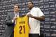 INDEPENDENCE, OH - JULY 19: Andrew Bynum holds up his new jersey as he is introduced as a new addition to the Cleveland Cavaliers alongside general manager Chris Grant at The Cleveland Clinic Courts on July 19, 2013 in Independence, Ohio in Cleveland, Oh