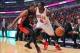 Dec 31, 2013; Chicago, IL, USA; Chicago Bulls small forward Luol Deng (9) is defended by Toronto Raptors shooting guard DeMar DeRozan (10) during the first quarter at the United Center. Mandatory Credit: Dennis Wierzbicki-USA TODAY Sports