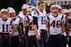 BALTIMORE, MD - DECEMBER 22: Quarterback Tom Brady #12 and members of of the New England Patriots wait to take the field against the Baltimore Ravens at M&T Bank Stadium on December 22, 2013 in Baltimore, Maryland. (Photo by Rob Carr/Getty Images)