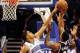 Dec 29, 2013; Orlando, FL, USA; Orlando Magic small forward Tobias Harris (12) and Orlando Magic power forward Glen Davis (11) try to block the shot of Atlanta Hawks point guard Jeff Teague (0) as the Orlando Magic beat the Atlanta Hawks 109-102 at Amway