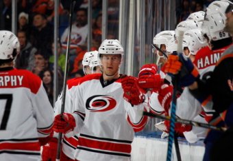 UNIONDALE, NY - JANUARY 04: Brett Sutter #42 of the Carolina Hurricanes celebrates his goal at 14:09 of the second period against the New York Islanders at the Nassau Veterans Memorial Coliseum on January 4, 2014 in Uniondale, New York.  (Photo by Bruce B
