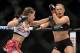 Dec 28, 2013; Las Vegas, NV, USA; Ronda Rousey (red gloves) and Miesha Tate (blue gloves) during their UFC Women's Bantamweight Championship Bout at the MGM Grand Garden Arena. Ronda Rousey won Mandatory Credit: Jayne Kamin-Oncea-USA TODAY Sports