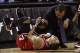 Feb 29, 2012; San Antonio, TX, USA; Chicago Bulls guard Derrick Rose (1) has his knee looked at by a trainer during the first half against the San Antonio Spurs at the AT&T Center. Mandatory Credit: Soobum Im-USA TODAY Sports