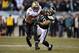 Jan 4, 2014; Philadelphia, PA, USA; New Orleans Saints running back Mark Ingram (22) attempts to break the tackle of Philadelphia Eagles outside linebacker Connor Barwin (98) during the first half 2013 NFC wild card playoff football game at Lincoln Financ