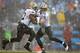 CHARLOTTE, NC - DECEMBER 22: Drew Brees #9 of the New Orleans Saints hands the ball off to Mark Ingram #22 of the New Orleans Saints during their game at Bank of America Stadium on December 22, 2013 in Charlotte, North Carolina. (Photo by Streeter Lec