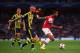 LONDON, ENGLAND - AUGUST 27: Theo Walcott (R) of Arsenal holds off the challenge of Raul Meireles (L) of Fenerbahce during the UEFA Champions League Play Off Second leg match between Arsenal FC and Fenerbahce SK at Emirates Stadium on August 27, 2013 in