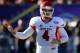LAS VEGAS, NV - DECEMBER 21: Quarterback Derek Carr #4 of the Fresno State Bulldogs signals teammates during the team's game against the USC Trojans in the Royal Purple Las Vegas Bowl at Sam Boyd Stadium on December 21, 2013 in Las Vegas, Nevada. USC won