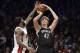 Jan 10, 2014; Brooklyn, NY, USA; Brooklyn Nets small forward Andrei Kirilenko (47) shoots over Miami Heat small forward LeBron James (6) during the second half at Barclays Center. The Brooklyn Nets won the game 104-95 in double overtime. Mandatory Credit: