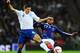 LONDON, ENGLAND - NOVEMBER 17: Andy Carroll of England battles with Yann M'Vila of France during the international friendly match between England and France at Wembley Stadium on November 17, 2010 in London, England. (Photo by Mike Hewitt/Getty Images)