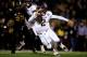 COLUMBIA, MO - NOVEMBER 30: Quarterback Johnny Manziel #2 of the Texas A&M Aggies scrambles as defensive lineman Markus Golden #33 of the Missouri Tigers persues during the game on November 30, 2013 in Columbia, Missouri. (Photo by Jamie Squire/Getty Im