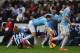 NEWCASTLE UPON TYNE, ENGLAND - JANUARY 12: Newcastle player Mapou Yanga-Mbiwa (l) fouls Samir Nasri who is later stretchered off during the Barclays Premier League match between Newcastle United and Manchestre City at St James' Park on January 12, 2014 i