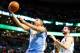 BOSTON, MA - DECEMBER 06: Andre Miller #24 of the Denver Nuggets drives to the basket for a layup in front of Vitor Faverani #38 of the Boston Celtics in the second half during the game at TD Garden on December 6, 2013 in Boston, Massachusetts. NOTE TO US