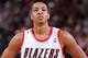 PORTLAND, OR - JANUARY 11: C.J. McCollum #3 of the Portland Trailblazers looks on against the Boston Celtics on January 11, 2014 at the Moda Center Arena in Portland, Oregon. NOTE TO USER: User expressly acknowledges and agrees that, by downloading and or