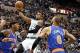 Oct 13, 2012; Hartford, CT, USA; Boston Celtics guard Rajon Rondo (9) shoots the ball against New York Knicks forward Carmelo Anthony (7) and center Tyson Chandler (6) during the first half at XL Center. Mandatory Credit: Mark L. Baer-USA TODAY Sports