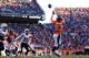 DENVER, CO - JANUARY 12: Wes Welker #83 of the Denver Broncos completes a second quarter touchdown pass against the San Diego Chargers during the AFC Divisional Playoff Game at Sports Authority Field at Mile High on January 12, 2014 in Denver, Colorado.