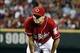 Sep 27, 2013; Cincinnati, OH, USA; Cincinnati Reds starting pitcher Homer Bailey watches from the mound after giving up a two-run home run to Pittsburgh Pirates third baseman Pedro Alvarez (not pictured) in the sixth inning at Great American Ball Park. Pi