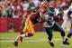 Sep 9, 2013; Landover, MD, USA; Philadelphia Eagles running back Bryce Brown (34) carries the ball as Washington Redskins inside linebacker Perry Riley (56) attempts the tackle in the second quarter at FedEx Field. The Eagles won 33-27. Mandatory Credit: